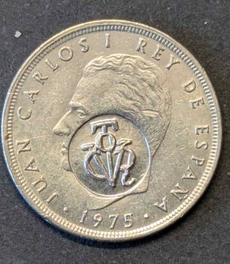 Moneda de 5 pesetas de 1975 Juan Carlos I con resello político (yugo y flechas)